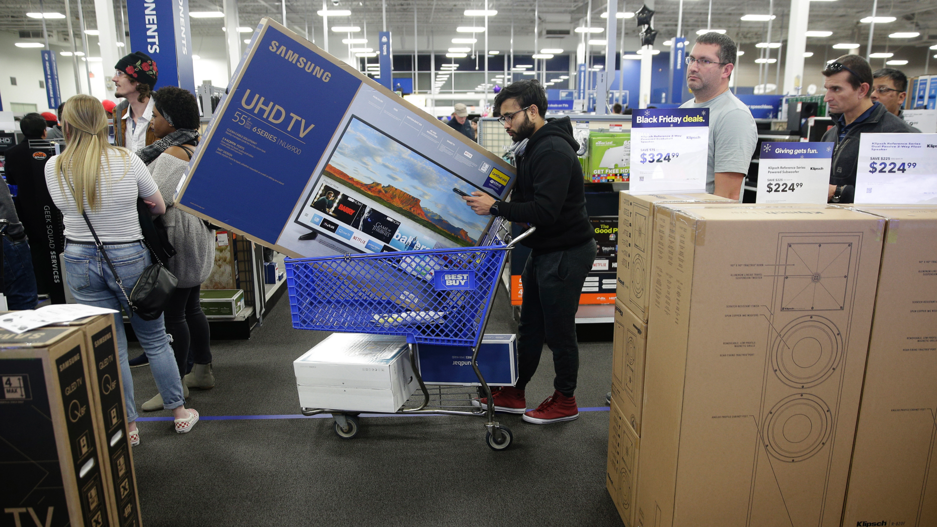 FILE. In this November 22, 2018, the movie photographers are waiting in line to purchase television while shopping during an early black Friday sale at a Best Buy store on Thanksgiving Day in Overland Park, Kan. Best Buy Co., Inc. reports financial results Wednesday, February 27, 2019. (AP Photo / Charlie Riedel, FIle)